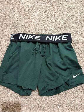 Nike Women's Forest Green Athletic Shorts with White Swoosh